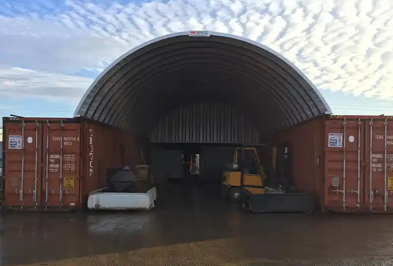 2 metal buildings salt lake container cover